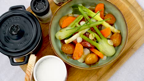 Slow-revealing-shot-of-a-prepared-meal-served-with-a-selections-of-spices