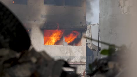 Bombed-building-massive-fire-burning-after-missile-attack-explosion-during-Israel-bombs-Gaza-killing-Palestinians,-Gaza-Strip