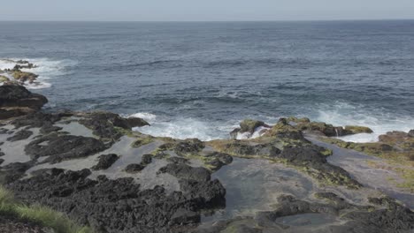 Rugged-coastline-of-Mosteiros,-Sao-Miguel-with-waves-crashing-on-volcanic-rocks