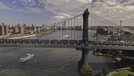 NYC-New-York-Aerial-v405-low-drone-flyover-East-river-and-waterfront-park-capturing-traffics-on-Manhattan-bridge,-cityscape-of-Dumbo-and-Brooklyn-downtown---Shot-with-Mavic-3-Pro-Cine---September-2023