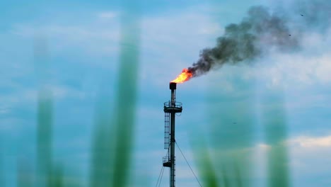 Industrial-Flare-Tower-With-Sky-Blue-Clouds-In-The-Backgroud