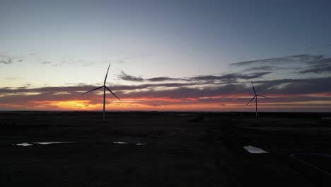 Silhouette-of-wind-turbine-blades-rotating-at-sunset,-Esperance-area-in-Western-Australia