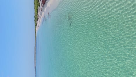 Drone-flying-over-transparent-waters-of-La-Cueva-in-Dominican-Republic