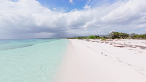 FPV-Flight-Over-White-Sand-Beach-In-Bahia-de-las-Aguilas-In-Pedernales,-Dominican-Republic