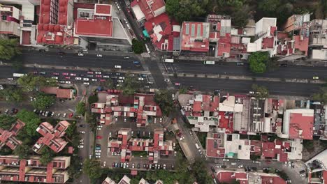 Slow-motion-aerial-view-of-an-intersection-on-an-avenue-in-Mexico-City