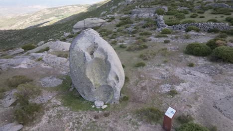 Orbital-flight-with-a-drone-visualizing-a-sacred-stone-used-to-ask-for-and-make-offerings-for-having-bowls-in-them-used-by-the-Celtiberian-peoples