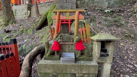 Collection-for-donations-and-statues-at-Fushimi-Inari-Taisha,-Kyoto-Japan