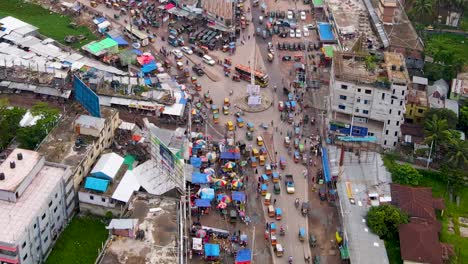 Aerial-view-of-Rupatoli-bus-stand-roundabout-traffic-in-Barisal,-Bangladesh
