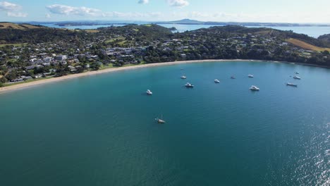 Big-Oneroa-Bay-Beach-In-Waiheke-Island,-Auckland,-New-Zealand---Aerial-Drone-Shot