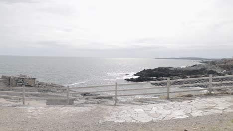 Beautiful-coastal-waters-and-rocky-shores-of-the-Atlantic-Ocean-in-a-public-park-in-Portand-Maine