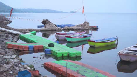 Pan-shot-of-tourist-boats-at-upper-lake-of-Bhopal-capital-city-of-Madhya-Pradesh-in-India-during-early-morning-time