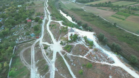 Flying-Over-the-Top-of-Hystorical-Complex-of-Old-Orhei-with-Iconic-Paths,-Near-Narrow-Bend-of-the-Raut-River,-Molodva