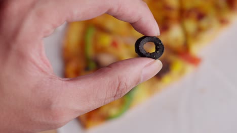 Oval-shape-black-olive,-delicious-pizza-slices,-vegetables-and-mozzarella