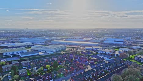 A-wide-angle-shot-capturing-rooftops-of-warehouses-and-cottages-neighbouring-with-railway-in-Derby,-England-on-a-sunny,-bright-day