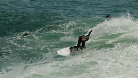 A-surfer-catches-a-nice-wave-at-Steamer-Lane-in-Santa-Cruz,-CA