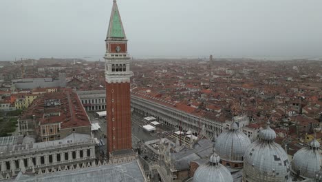 Venice-Italy-downtown-descending-aerial-at-tower-on-foggy-day