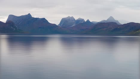 Mountains-tower-above-the-calm-fjord