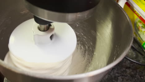 Close-up-for-bread-making-process-by-using-flour-mixing-machine