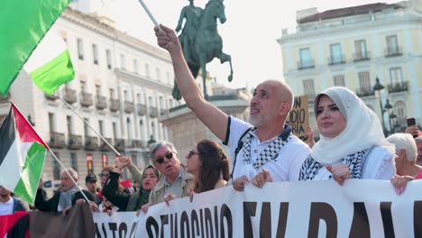 Protesters-shout-slogans-and-hold-Palestine-flags-in-solidarity-with-Palestine-demanding-the-Spanish-government-stop-weapons-commerce-to-the-State-of-Israel-in-Madrid,-Spain