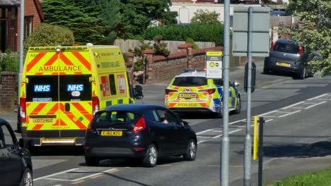 Police-and-paramedic-ambulance-attending-road-traffic-incident-in-UK-neighbourhood