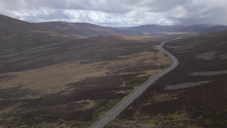 Lonely-Car-Drives-on-Remote-Road-In-Airy-Highlands---Aerial