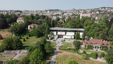 Static-high-angle-view-of-the-Olympic-Museum-and-Olympic-park-in-Lausanne,-Switzerland-on-a-sunny,-summer-day