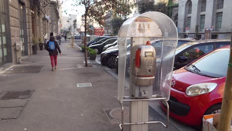 One-of-the-last-public-telephone-booths,-owned-by-Telecom-Italia-company---Naples,-Italy