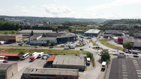 Dynamic-aerial-of-a-peugeot-car-dealership-on-a-thriving-industrial-site