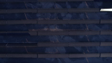 Solar-Panels-Array,-Birds-Eye-Aerial-View-of-Solar-Power-Plant-in-Twilight