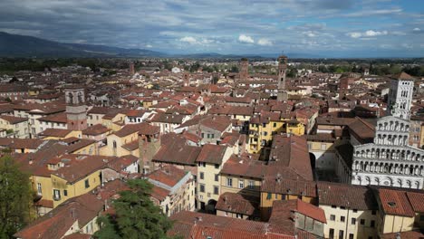 Lucca-Italy-flight-over-downtown-as-clouds-come-through,-great-candidate-for-timelapse
