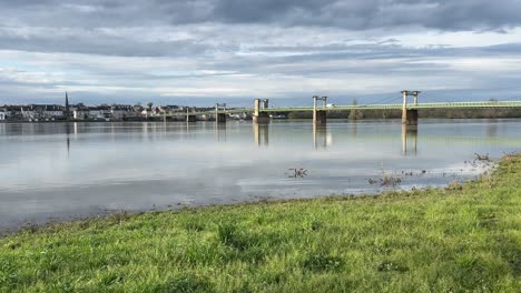 Looking-across-a-flooded-River-Loire-towards-Ingrandes-Le-Fresne-sur-Loire-with-bridge