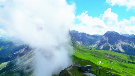 View-from-above,-stunning-aerial-view-of-the-mountain-range-of-Seceda-during-a-cloudy-day