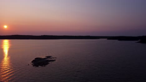 Flying-Over-Stockholm-Archipelago-In-Baltic-Sea,-Sweden-During-Sunset-In-Summer,-Aerial-Wide-Shot
