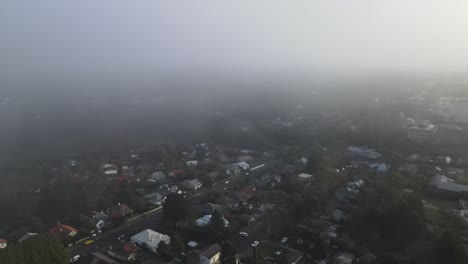 Drone-aerial-going-under-some-clouds-in-the-town-of-Katoomba