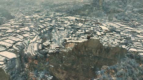 Aerial-Overhead-View-Of-Snow-Covered-Terraces-High-Above-In-Hunza-Valley