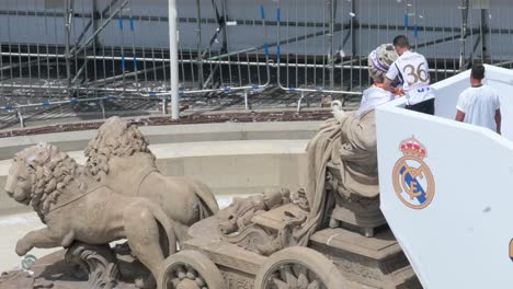 Real-Madrid-team-captain,-Nacho-Fernandez,-is-seen-decorating-the-Fountain-of-Cibeles-at-at-Cibeles-Square-celebrating-the-36th-Spanish-soccer-league-title