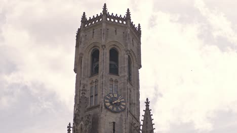 Clock-On-Belfry-Of-Bruges-Against-Cloudy-Sky-In-Bruges,-Belgium