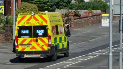 Paramedic-ambulance-waiting-at-road-traffic-incident-in-British-neighbourhood