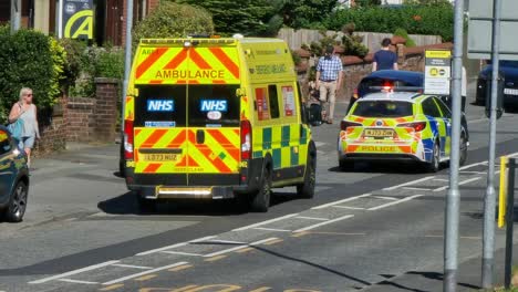 Police-and-paramedic-ambulance-attending-road-traffic-collision-in-British-neighbourhood