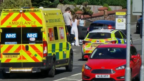 Police-and-paramedic-ambulance-attending-road-traffic-incident-in-British-city-street