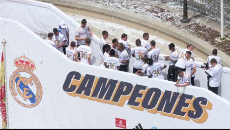 Real-Madrid-players-celebrate-their-36th-La-Liga-championship-beside-the-word-'Champions'-at-Cibeles-Square-in-Madrid