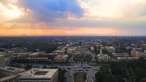 Aerial-of-downtown-of-Cairo-meanders-through-Cairo-city,-with-a-drone-gliding-past-the-Cairo-Tower-in-Cairo,-Egypt,-embodying-the-concept-of-urban-vitality-and-architectural-marvels