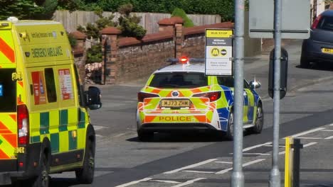 Police-and-paramedic-ambulance-attending-road-traffic-incident-in-British-street