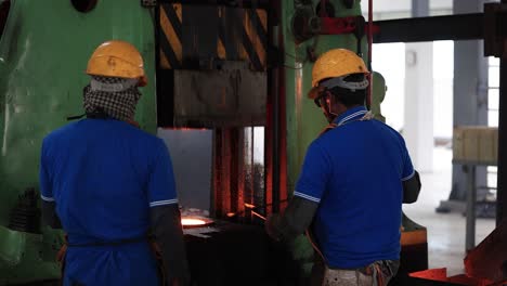 Where-people-are-forging-very-heavy-parts-components,-Industrial-safety-first-concept