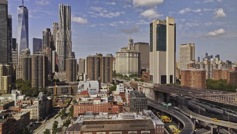 NYC-New-York-Aerial-v415-low-drone-flyover-East-river-across-Lower-Manhattan-capturing-Financial-district-downtown-cityscape-with-towering-skyscrapers---Shot-with-Mavic-3-Pro-Cine---September-2023