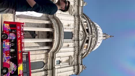 Looking-Up-At-St-Paul's-Cathedral-With-Sightseeing-Bus-Stuck-In-Traffic-Along-St