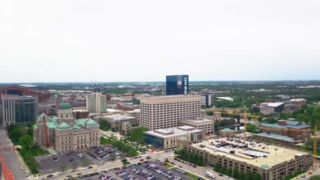 JW-Marriot-hotel-aerial-view-approaching-huge-official-event-logo-celebrating-Indianapolis-500-across-downtown-Indiana-skyline