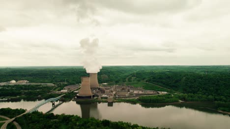 A-drone-shot-of-a-nuclear-power-plant-located-on-a-river-in-Pittsburg,-PA
