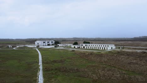 Low-aerial-shot-of-abandoned-military-base-and-Voice-of-America-radio-station-headquarters-in-Greece