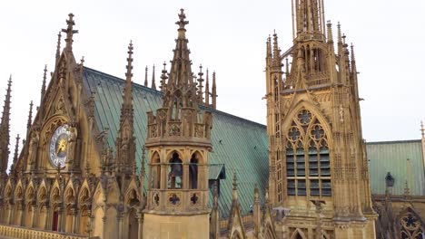 Metz-Cathedral-of-Saint-Stephen-in-France,-gothic-architecture-bell-tower-and-clock,-aerial